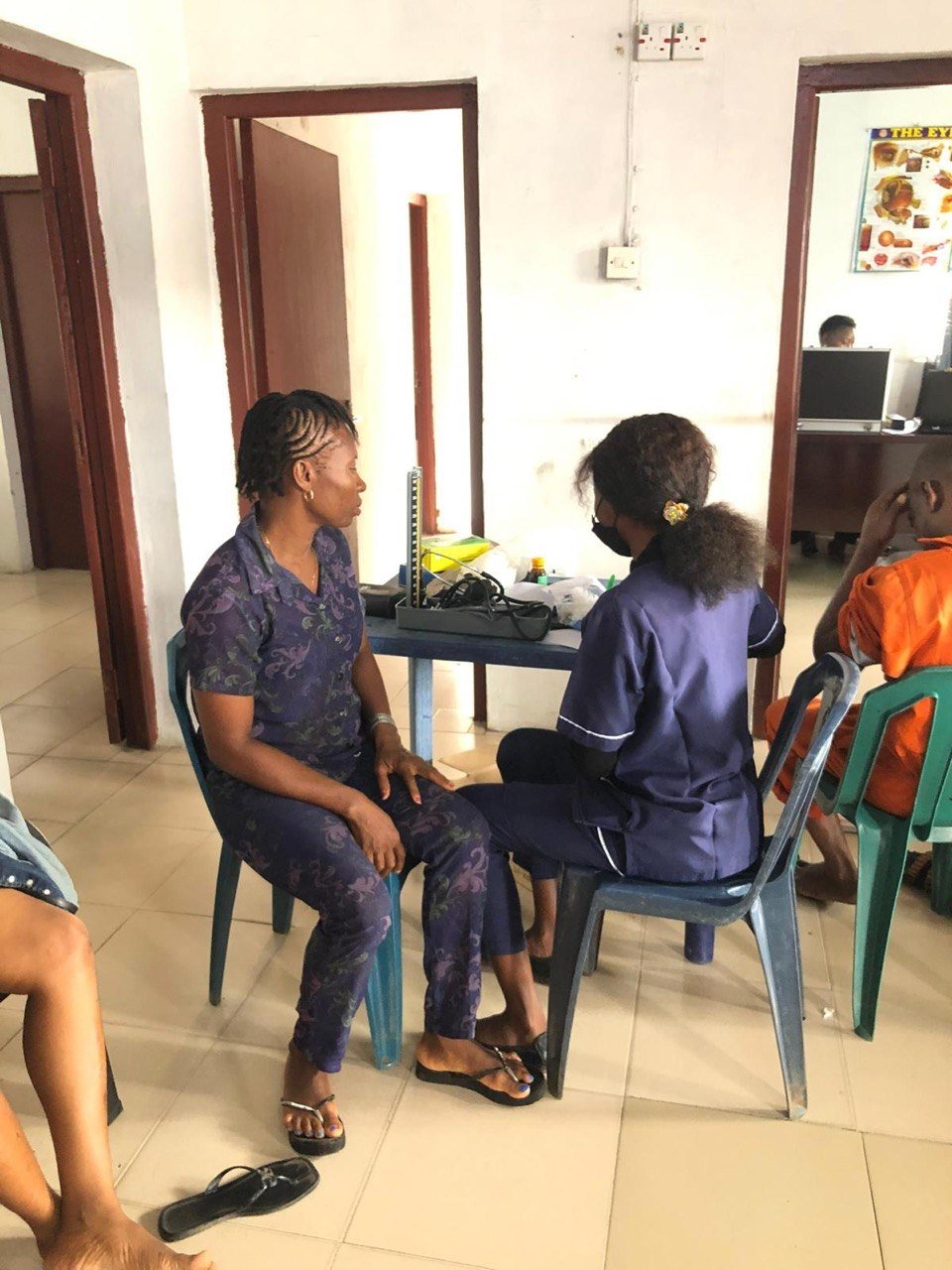 A nurse recording a patient's details